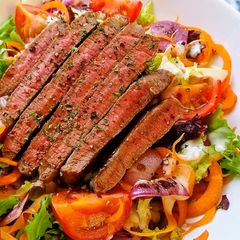 A picture of Seared Steak Salad With Charred Tomato & Onions.
