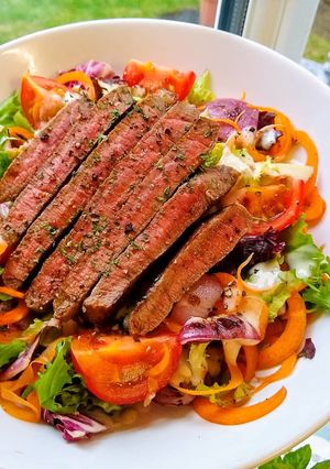 A picture of Seared Steak Salad With Charred Tomato & Onions.