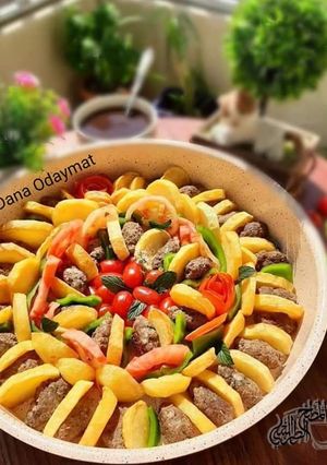 A picture of Kofta bil Saniyeh (Baked Kofta with Vegetables).