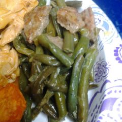 A picture of Peppered green beans and sausage.