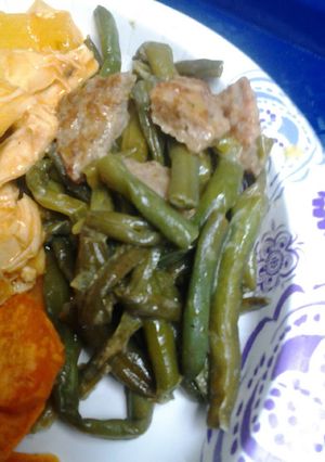 A picture of Peppered green beans and sausage.