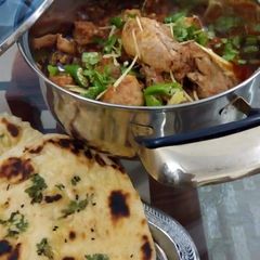 Chicken karahi with garlic naan (homemade) A picture of Chicken karahi with garlic naan (homemade).