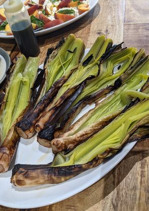 A picture of Char-grilled leeks.