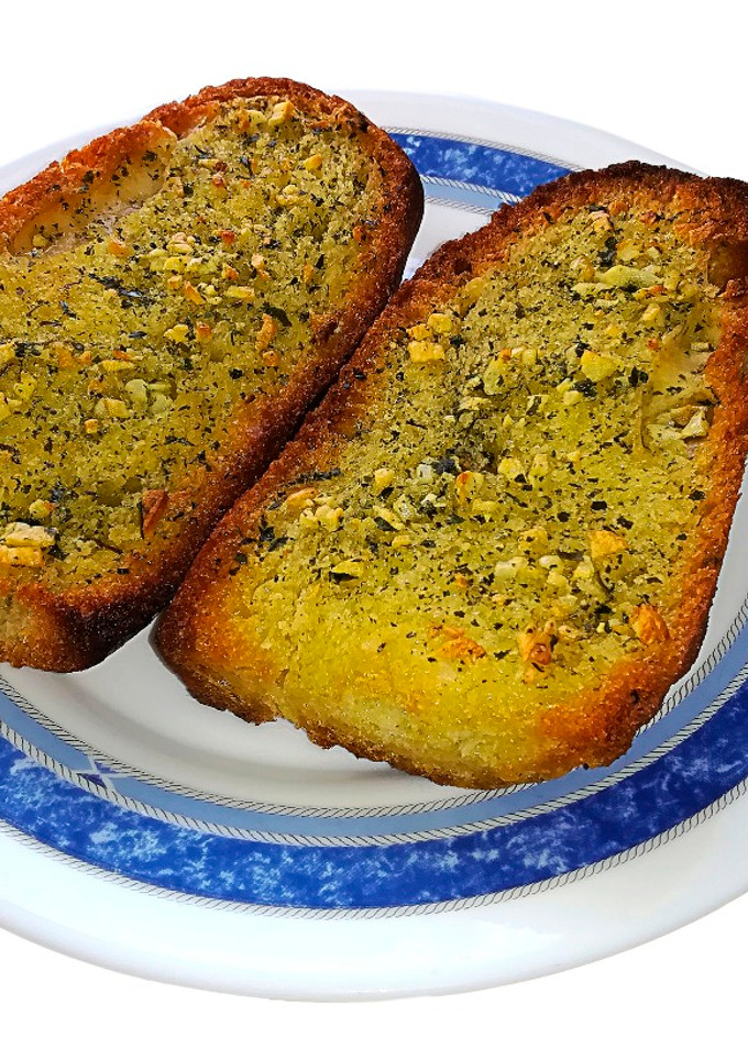 Una foto de Tostas de ajo y perejil