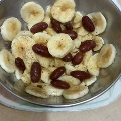 A picture of Snacks time, banana and red beans 🍌🍌.