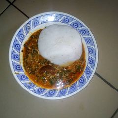 A picture of Tuwon masara with egusi soup.