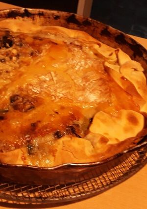 Una foto de Tarta fina de portobellos champignon y brie