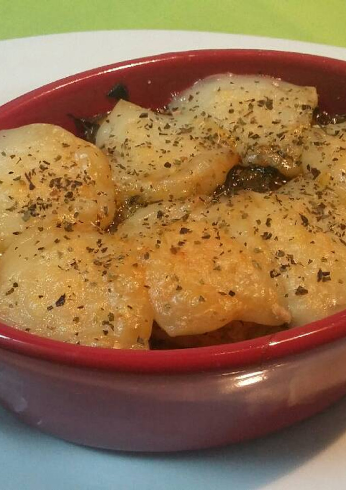 Una foto de Cocotte con ñoquis, espinacas y queso de cabra