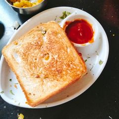 A picture of Vegetable Toast sandwich with Spicy Coriander Chutney.