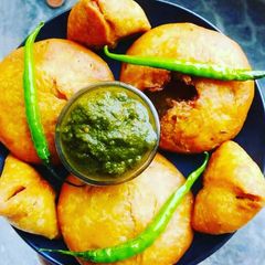 A picture of Mung dal kachori with chutney.