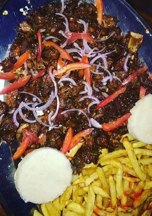 A picture of Fried beef with Chips.