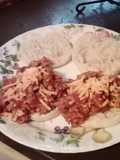 Sloppy joe on a English muffin with cheese