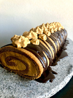 Una foto de Brazo de Reina manjar café (brazo de gitano)