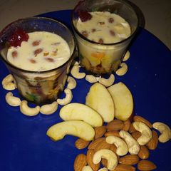 A picture of Apple keshar milk with dry fruits.