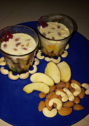 A picture of Apple keshar milk with dry fruits.