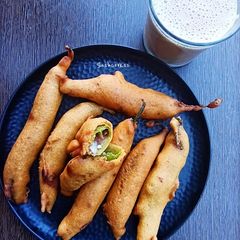 A picture of MIRCHI KE PAKODE/GREEN CHILLI FRITTERS.