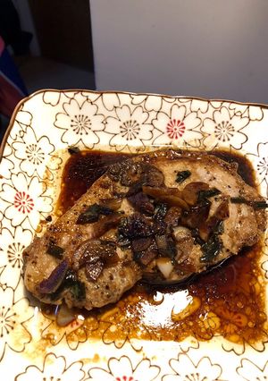 A picture of Pan fried pork chop with soy sauce.