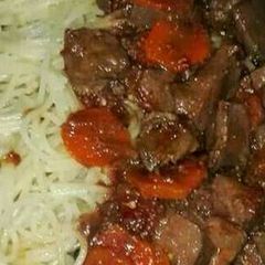 A picture of Liver stew and spaghetti.