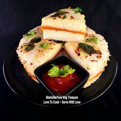 A picture of Homemade Schezwan Sauce Sandwich White Dhokla.