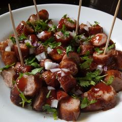 A picture of #My kids Favourite dish contest Sausage biting.
