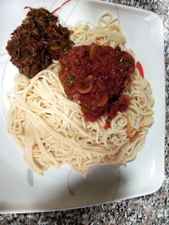 A picture of Spaghetti Tomato and vegetables sauce.