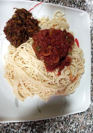 A picture of Spaghetti Tomato and vegetables sauce.