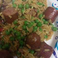 A picture of Smoked Beef Sausage and Yellow Rice.