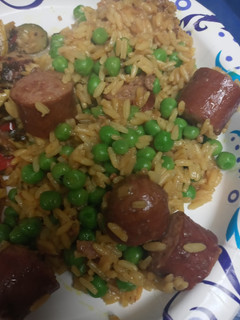 A picture of Smoked Beef Sausage and Yellow Rice.
