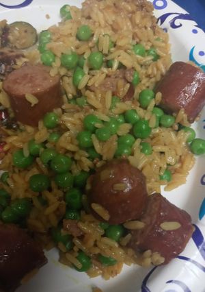 A picture of Smoked Beef Sausage and Yellow Rice.
