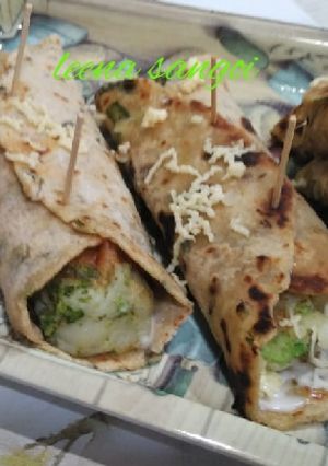 A picture of Oats spring onion paratha  broccoli cheese tikki kathi roll.