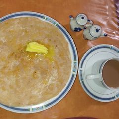 A picture of Karara Khasta Paratha with butter and Tea 🍵.
