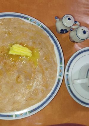 A picture of Karara Khasta Paratha with butter and Tea 🍵.
