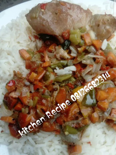 A picture of White rice and chicken sauce.