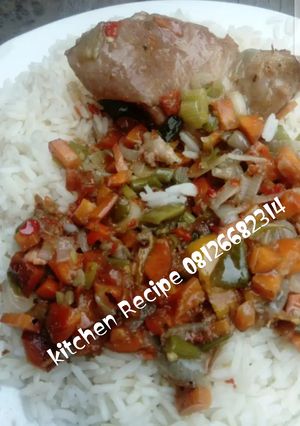 A picture of White rice and chicken sauce.