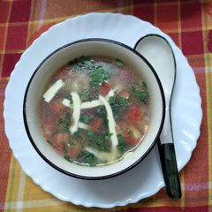 A picture of Clear soup with winter vegetables.