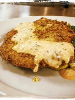 A picture of Cornmeal Panko Crusted Catfish with a Sriracha Remoulade.