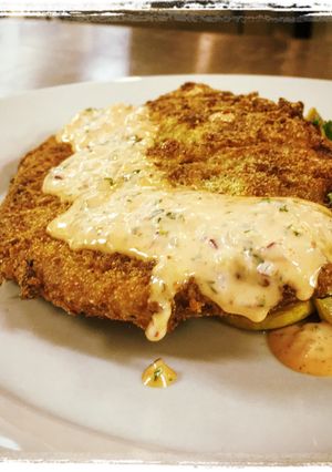 A picture of Cornmeal Panko Crusted Catfish with a Sriracha Remoulade.