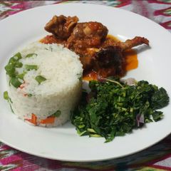 A picture of Veggie white rice and goat meat stew.