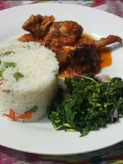 A picture of Veggie white rice and goat meat stew.