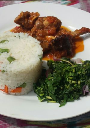 A picture of Veggie white rice and goat meat stew.