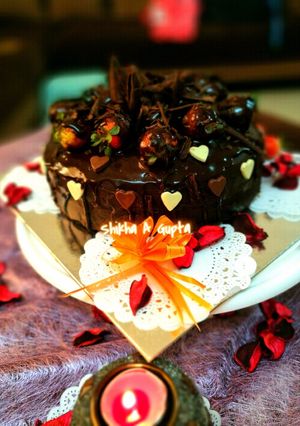 A picture of Eggless dripping chocolate cake.