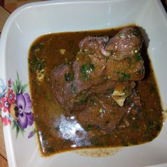 A picture of Ewedu soup and goat meat pepper soup.