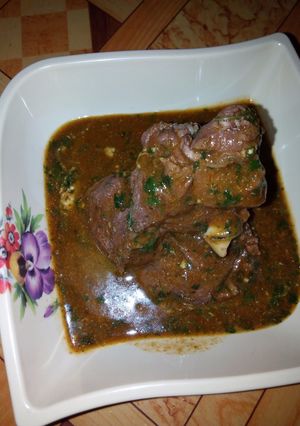 A picture of Ewedu soup and goat meat pepper soup.
