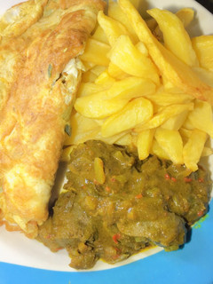 A picture of Fried irish with egg and curry liver.