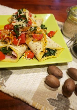 Una foto de Canelones 🌯rellenos de espinaca con salsa de cherrys🍅