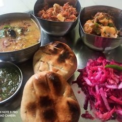 A picture of Tandoori stuff batti with panchratan dal.