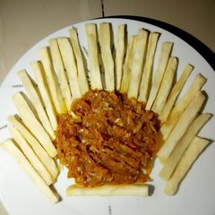 A picture of Fried yam with carrot sauce.