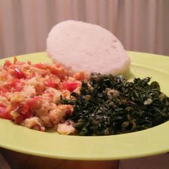 A picture of Wet fried eggs, ugali and spinach.