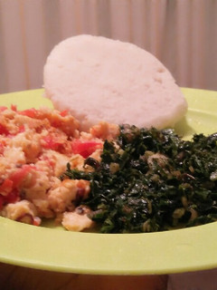 A picture of Wet fried eggs, ugali and spinach.