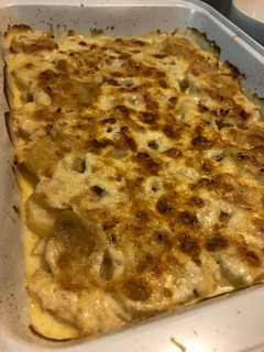 Una foto de Papas a la crema con cebolla y queso